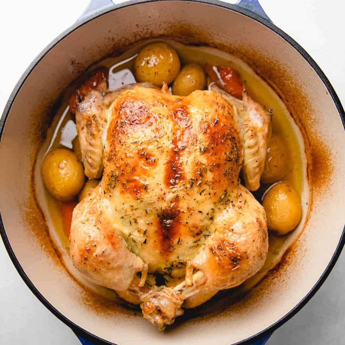Dutch Oven Whole Chicken with Crispy Skin and Herb Butter